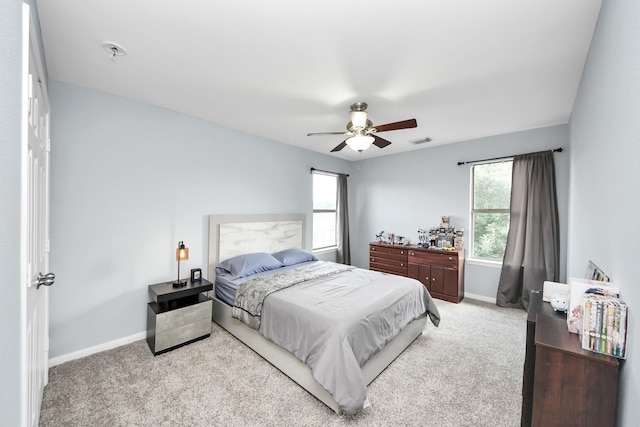 7619 Park Sage Ln, Cypress, TX 77433 - bedroom featuring multiple windows, carpet floors, and a ceiling fan
