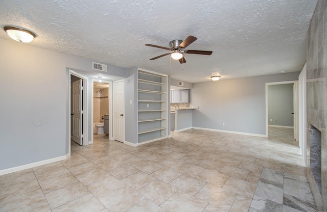 10555 Turtlewood Ct Unit 2802, Houston, TX 77072 - unfurnished living room with a ceiling fan and a textured ceiling