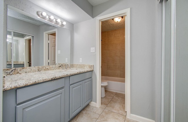 10555 Turtlewood Ct Unit 2802, Houston, TX 77072 - full bathroom featuring tile patterned floors, vanity, and a textured ceiling