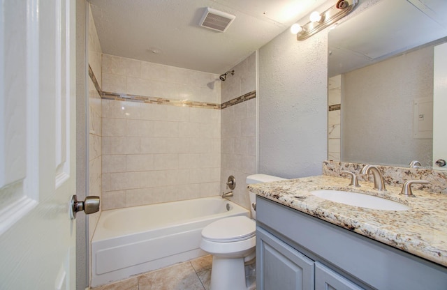 10555 Turtlewood Ct Unit 2802, Houston, TX 77072 - bathroom with vanity,  shower combination, a textured wall, and tile patterned floors