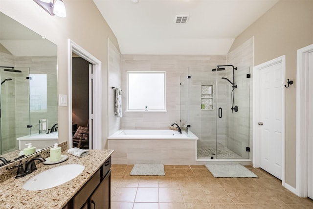 4507 Cinco Forest Trl, Katy, TX 77494 - bathroom featuring vanity, a garden tub, a shower stall, tile patterned flooring, and vaulted ceiling