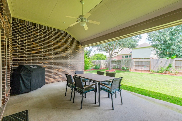 4507 Cinco Forest Trl, Katy, TX 77494 - fenced backyard featuring outdoor dining area, a ceiling fan, a patio area, and grilling area