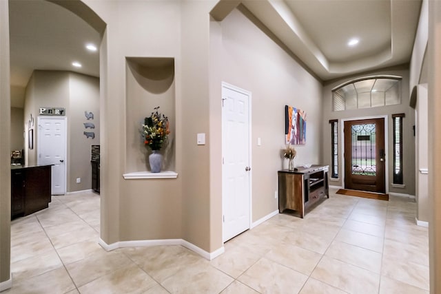 4507 Cinco Forest Trl, Katy, TX 77494 - foyer with light tile patterned floors, arched walkways, and recessed lighting