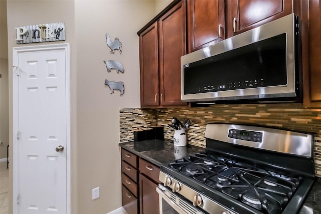 4507 Cinco Forest Trl, Katy, TX 77494 - kitchen featuring stainless steel appliances, decorative backsplash, and dark stone counters