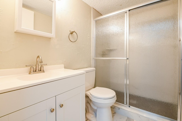 325 Carolcrest Ln Unit 3, Livingston, TX 77351 - bathroom featuring a textured ceiling, a shower stall, vanity, marble finish floors, and a textured wall