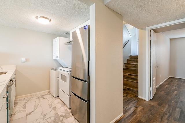 325 Carolcrest Ln Unit 3, Livingston, TX 77351 - washroom with a textured ceiling and baseboards