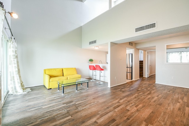 325 Carolcrest Ln Unit 3, Livingston, TX 77351 - sitting room featuring wood finished floors and a high ceiling