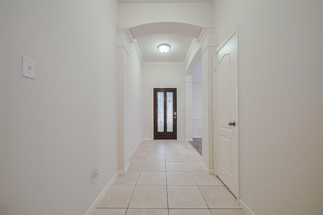 5515 Brookhollow Pines Ct, Houston, TX 77084 - hallway featuring arched walkways, light tile patterned flooring, and crown molding