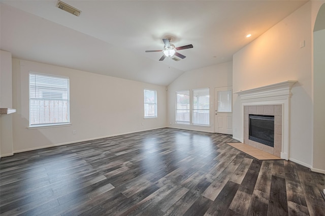 5515 Brookhollow Pines Ct, Houston, TX 77084 - unfurnished living room featuring ceiling fan, dark wood-style flooring, lofted ceiling, and a tile fireplace