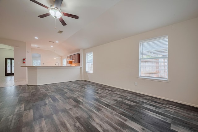 5515 Brookhollow Pines Ct, Houston, TX 77084 - unfurnished living room featuring wood finished floors, vaulted ceiling, a ceiling fan, arched walkways, and recessed lighting