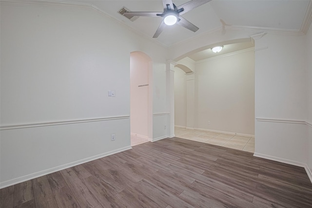 5515 Brookhollow Pines Ct, Houston, TX 77084 - spare room with vaulted ceiling, a ceiling fan, wood finished floors, arched walkways, and crown molding
