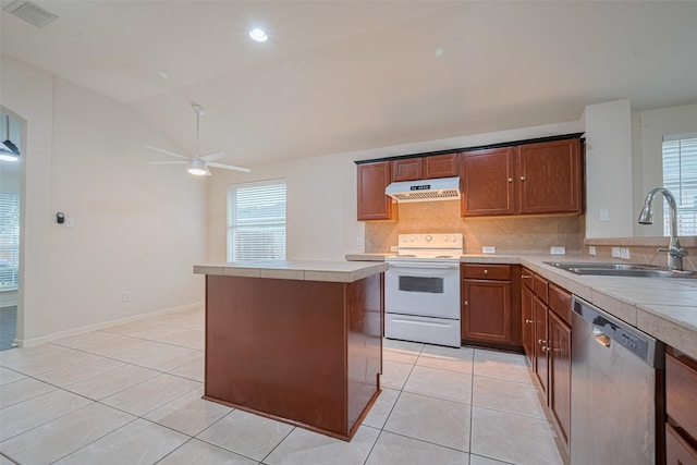 5515 Brookhollow Pines Ct, Houston, TX 77084 - kitchen with stainless steel dishwasher, electric stove, exhaust hood, light countertops, and backsplash