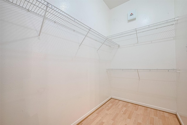 5515 Brookhollow Pines Ct, Houston, TX 77084 - spacious closet featuring wood finished floors