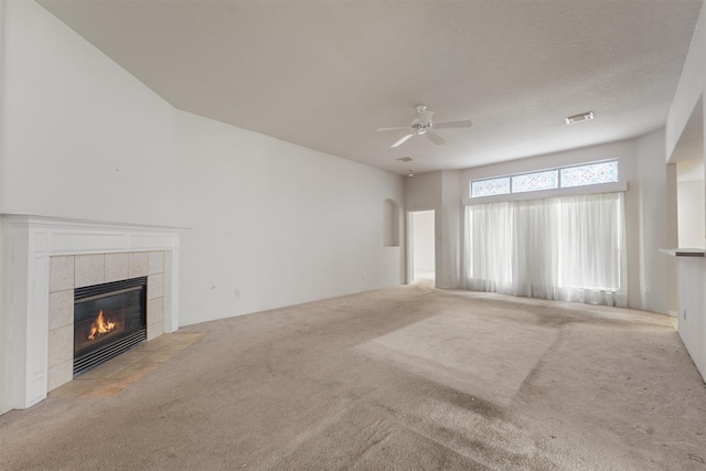 5723 Painted Trail Dr, Houston, TX 77084 - unfurnished living room featuring a fireplace, carpet flooring, and a ceiling fan