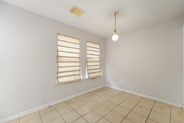 5723 Painted Trail Dr, Houston, TX 77084 - empty room featuring baseboards and light tile patterned floors