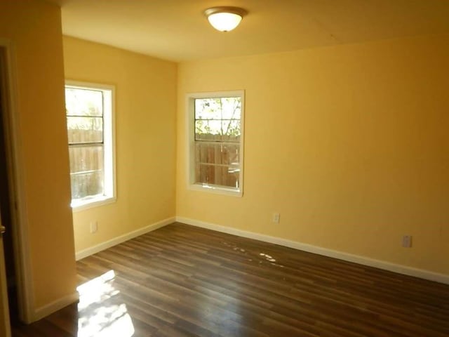 7121 Conley St, Houston, TX 77021 - unfurnished room featuring dark wood-type flooring and baseboards