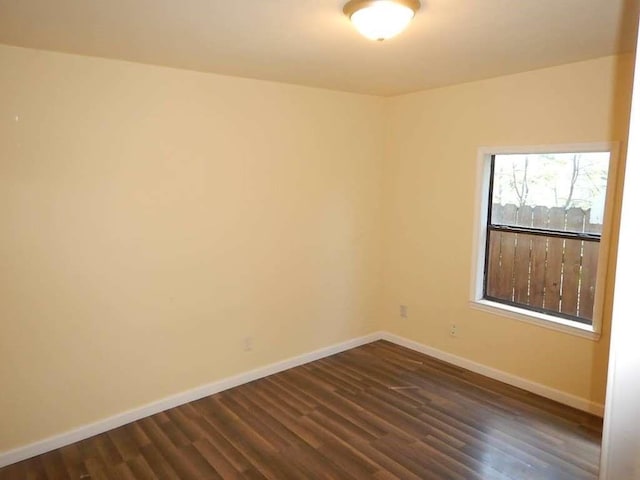 7121 Conley St, Houston, TX 77021 - unfurnished room featuring baseboards and dark wood-style flooring