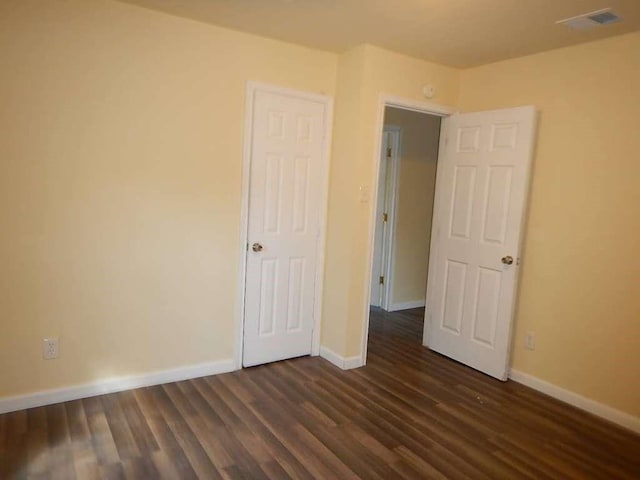 7121 Conley St, Houston, TX 77021 - unfurnished bedroom with dark wood finished floors