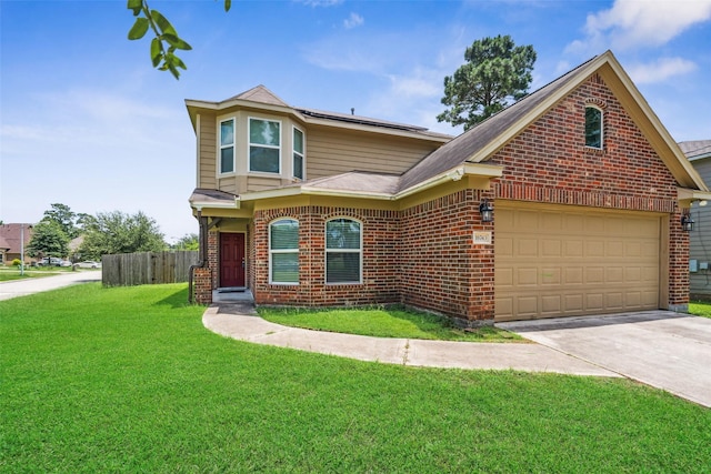 16743 Fallen Timbers Dr, Conroe, TX 77385 - view of front facade featuring brick siding, driveway, roof mounted solar panels, and roof with shingles