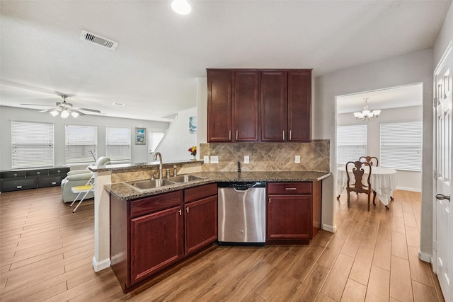 16743 Fallen Timbers Dr, Conroe, TX 77385 - kitchen featuring dishwasher, light wood finished floors, decorative backsplash, a peninsula, and a ceiling fan