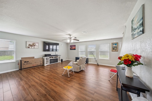 16743 Fallen Timbers Dr, Conroe, TX 77385 - living room featuring plenty of natural light, a textured ceiling, ceiling fan, and wood finished floors