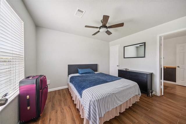 16743 Fallen Timbers Dr, Conroe, TX 77385 - bedroom featuring multiple windows, wood finished floors, and ceiling fan