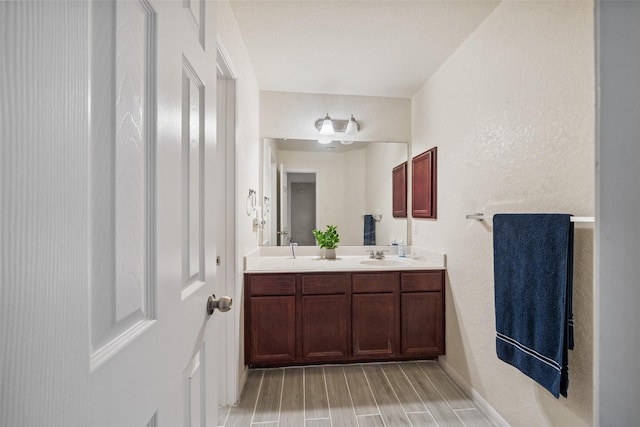 16743 Fallen Timbers Dr, Conroe, TX 77385 - full bath with double vanity and wood finished floors