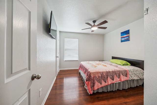 16743 Fallen Timbers Dr, Conroe, TX 77385 - bedroom with wood-type flooring and ceiling fan
