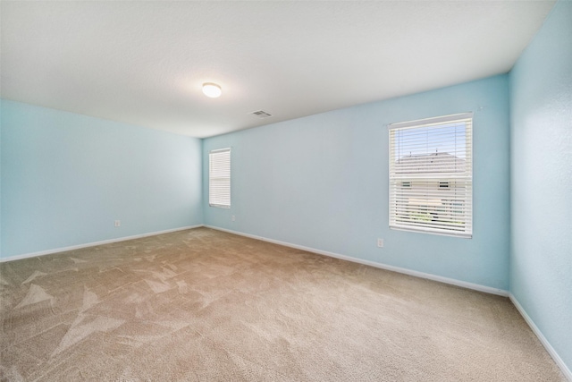 16743 Fallen Timbers Dr, Conroe, TX 77385 - empty room with carpet and plenty of natural light