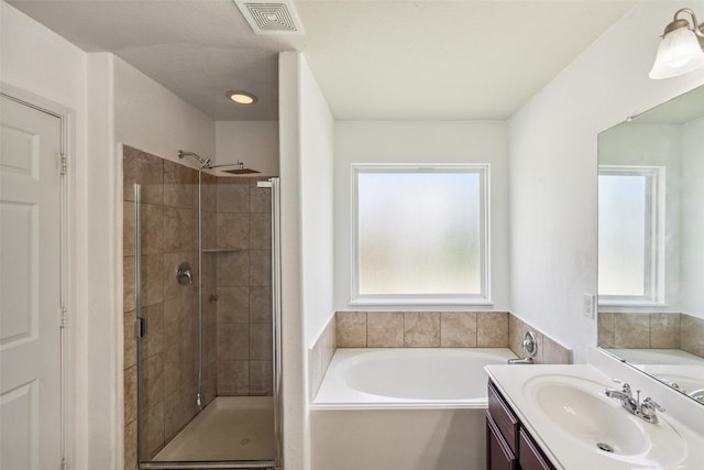 16743 Fallen Timbers Dr, Conroe, TX 77385 - full bathroom featuring a bath, a shower stall, and vanity