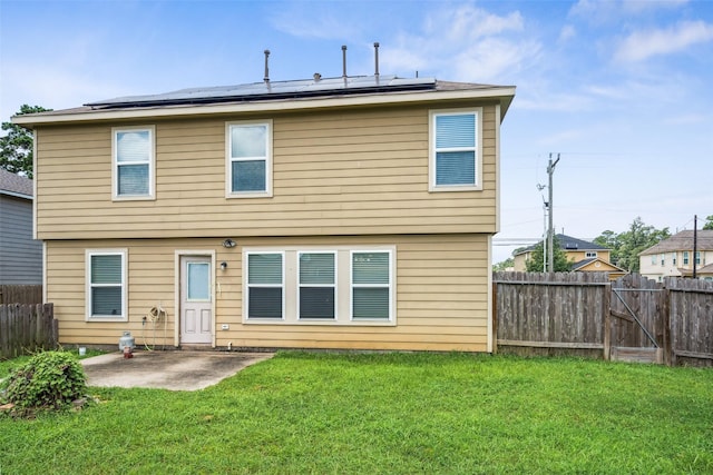 16743 Fallen Timbers Dr, Conroe, TX 77385 - rear view of property featuring a patio area, solar panels, and a fenced backyard