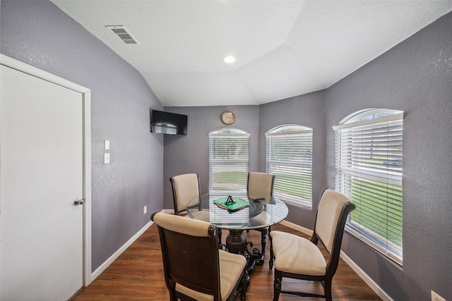 16743 Fallen Timbers Dr, Conroe, TX 77385 - dining space with a textured wall, wood finished floors, vaulted ceiling, and an office area