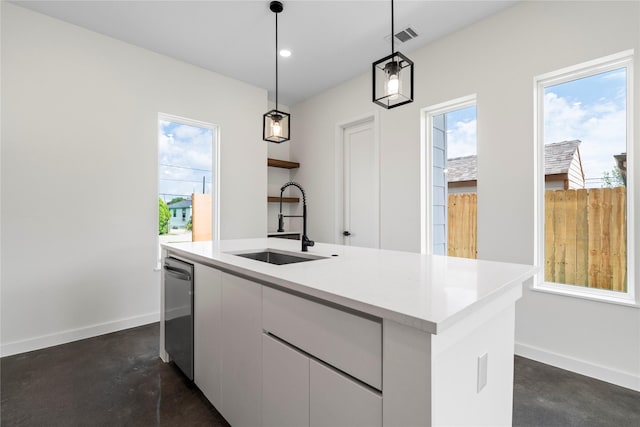 8205 Parnell St, Houston, TX 77051 - kitchen featuring finished concrete flooring, healthy amount of natural light, and white cabinets