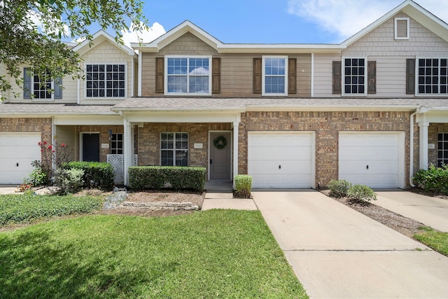 8342 Cassidy Creek Ct, Houston, TX 77095 - view of front of home featuring driveway, an attached garage, brick siding, and a front lawn