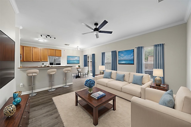 8342 Cassidy Creek Ct, Houston, TX 77095 - living room featuring dark wood-style floors, ornamental molding, and a ceiling fan