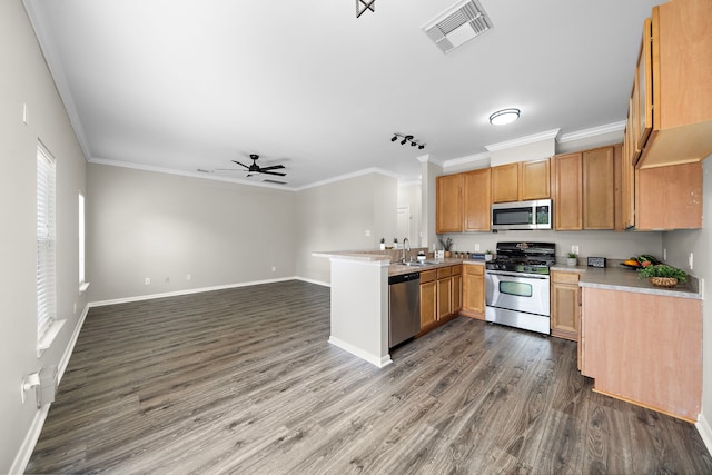 8342 Cassidy Creek Ct, Houston, TX 77095 - kitchen with stainless steel appliances, a peninsula, crown molding, a ceiling fan, and dark wood-style floors