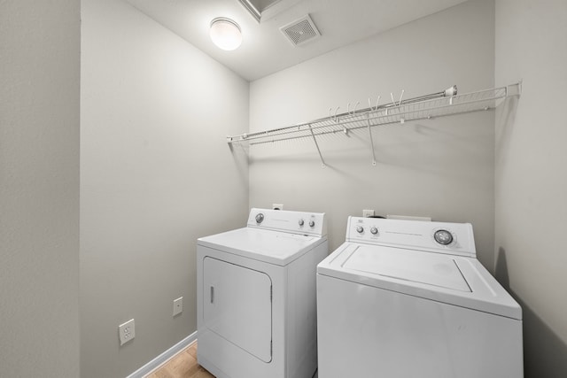 8342 Cassidy Creek Ct, Houston, TX 77095 - laundry area featuring independent washer and dryer and light wood finished floors