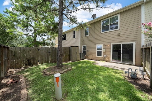 8342 Cassidy Creek Ct, Houston, TX 77095 - back of house featuring a storage unit, a fenced backyard, and a patio area