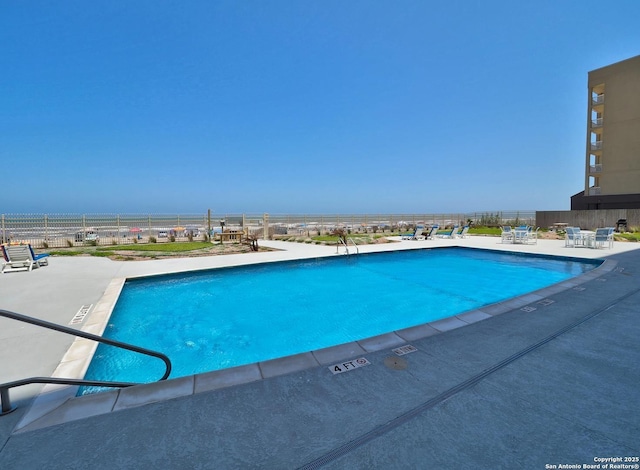 15002 Windward Dr Unit 207, Corpus Christi, TX 78418 - community pool with a patio area