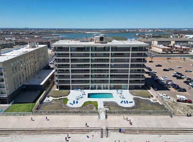 15002 Windward Dr Unit 207, Corpus Christi, TX 78418 - drone / aerial view of a pool and a nearby body of water