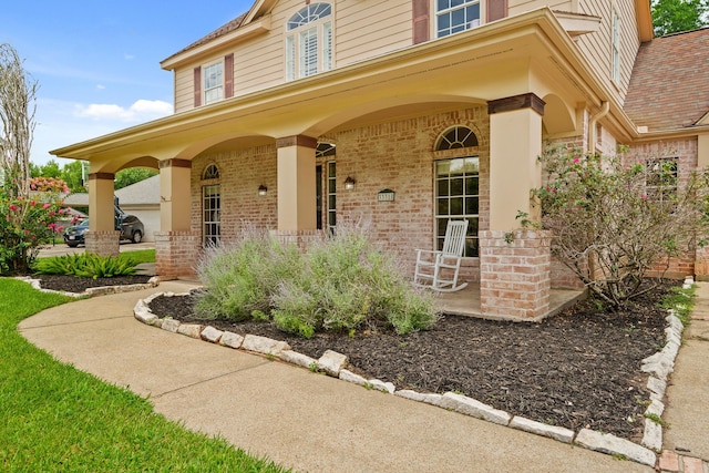 33318 Winsford St, Fulshear, TX 77441 - property entrance with a porch and brick siding
