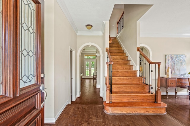 33318 Winsford St, Fulshear, TX 77441 - foyer with arched walkways, stairway, hardwood / wood-style flooring, and crown molding