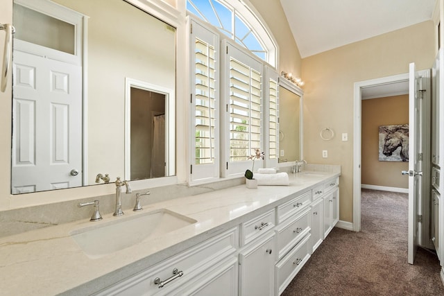 33318 Winsford St, Fulshear, TX 77441 - bathroom with double vanity and vaulted ceiling