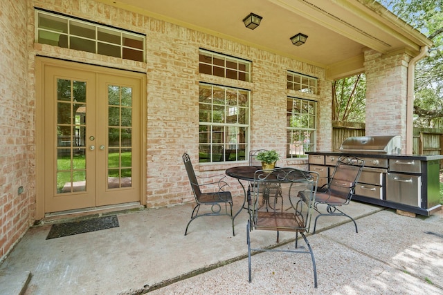 33318 Winsford St, Fulshear, TX 77441 - view of patio with french doors, outdoor dining space, and grilling area