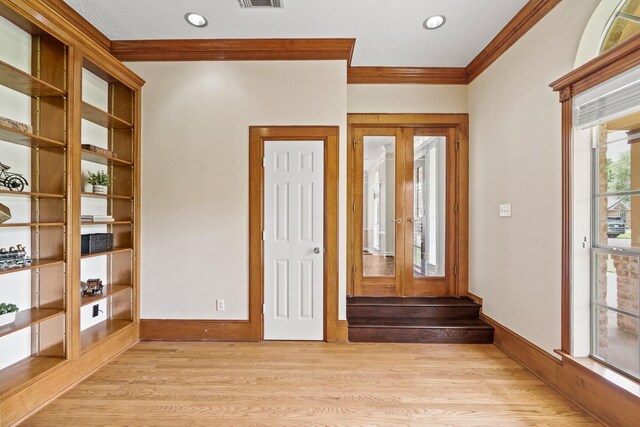 33318 Winsford St, Fulshear, TX 77441 - entrance foyer with ornamental molding, light wood-type flooring, and french doors
