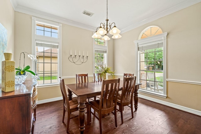 33318 Winsford St, Fulshear, TX 77441 - dining room with healthy amount of natural light, dark wood-style floors, a chandelier, and crown molding