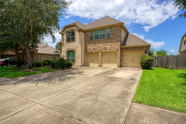 3922 Crestwind Ln, Richmond, TX 77407 - view of front facade featuring brick siding, roof with shingles, driveway, and a garage