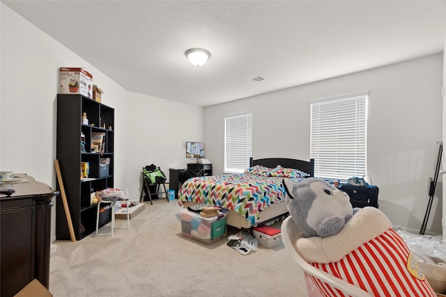 3922 Crestwind Ln, Richmond, TX 77407 - bedroom featuring light carpet