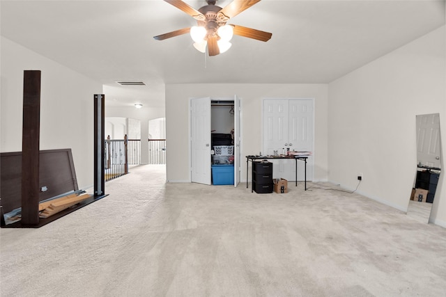 3922 Crestwind Ln, Richmond, TX 77407 - unfurnished living room featuring ceiling fan and light colored carpet