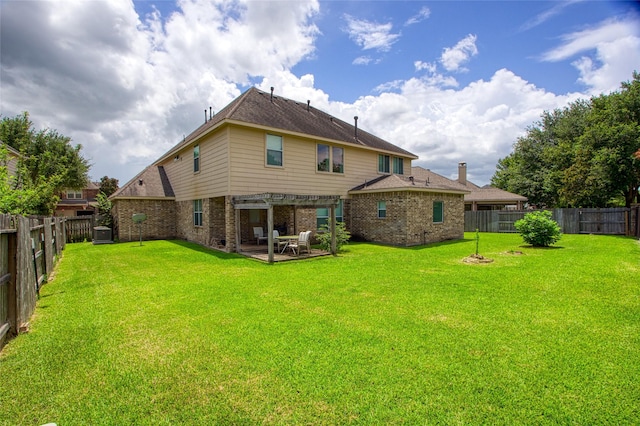 3922 Crestwind Ln, Richmond, TX 77407 - back of property featuring a pergola, brick siding, a fenced backyard, and a patio